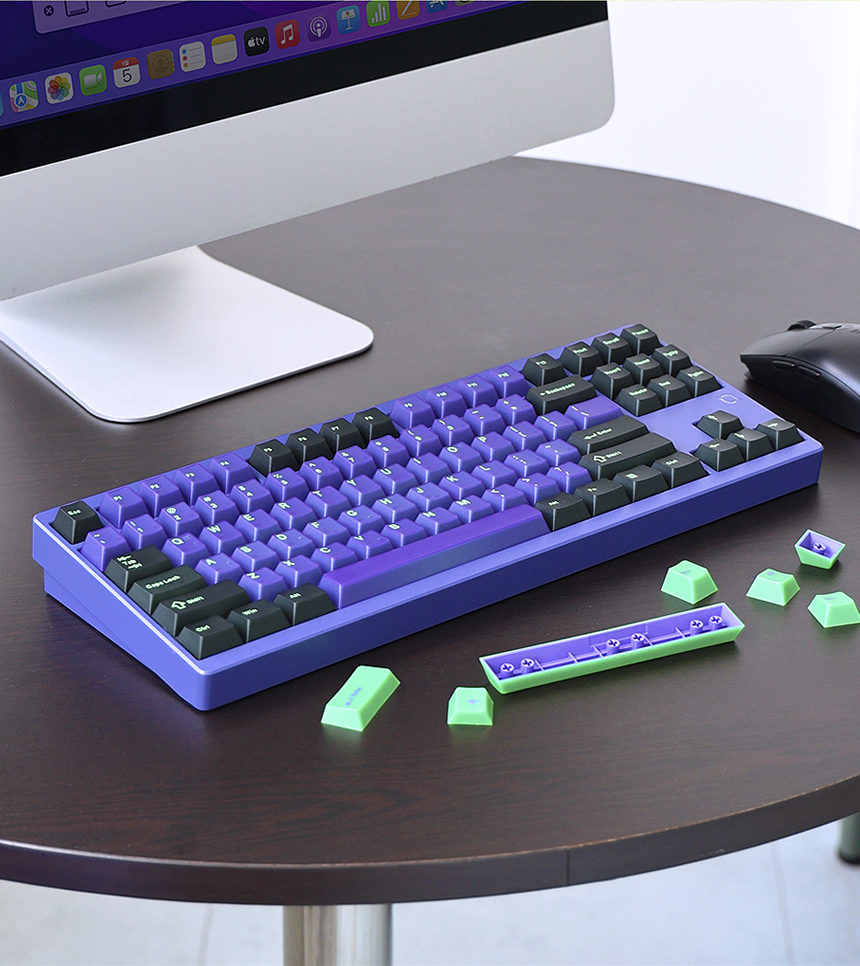 Close-up view of hot-swappable switch sockets and spare switches, illustrating the ease of switch replacement.